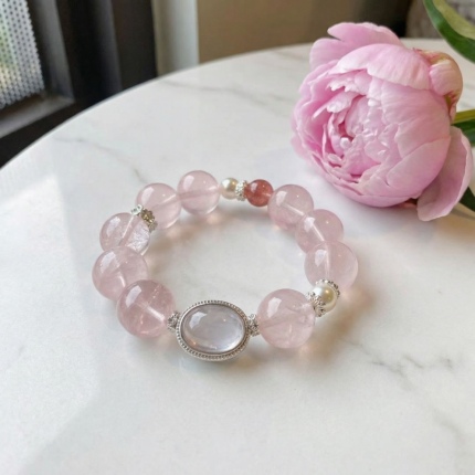 Main image: Natural rose quartz bracelet with 8–10mm beads and 15–16mm central bead