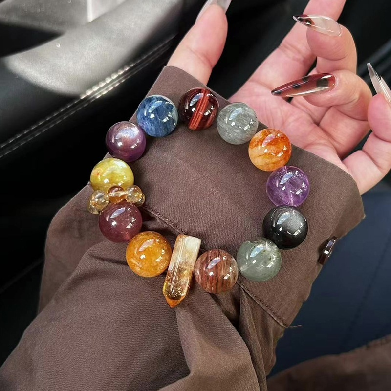 18mm crystal beads on wrist for size reference, multi-gem bracelet detail shot