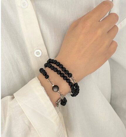 White crystal and golden obsidian sugar cube faceted beads, multi-faceted square cut crystal beads, clear and gold-black chatoyant surfaces, crystal bead detail