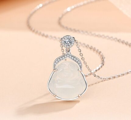 S925 silver pendant necklace with hand-carved white agate Laughing Buddha, small round cubic zirconia ornaments on polished silver frame, fine silver chain, minimalist white background