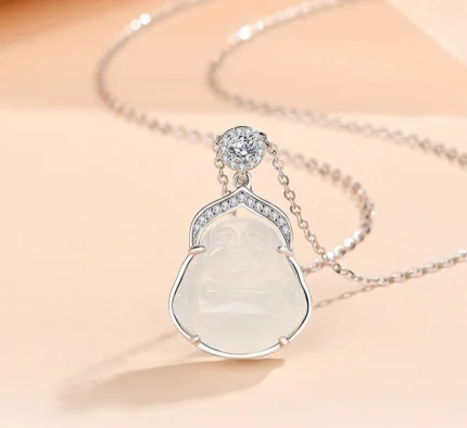 S925 silver pendant necklace with hand-carved white agate Laughing Buddha, small round cubic zirconia ornaments on polished silver frame, fine silver chain, minimalist white background