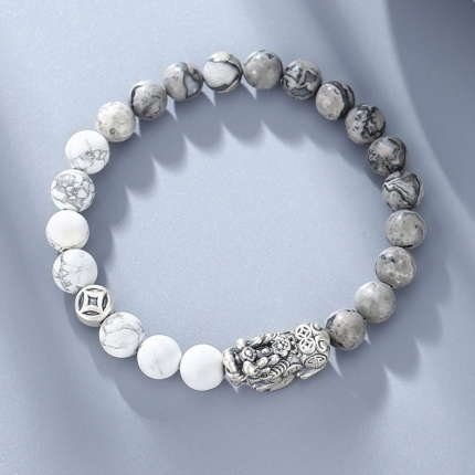 A men's white marble howlite stretch bracelet with an S925 silver Pixiu charm, beads ~8mm, arranged in a closed circle on a light background.