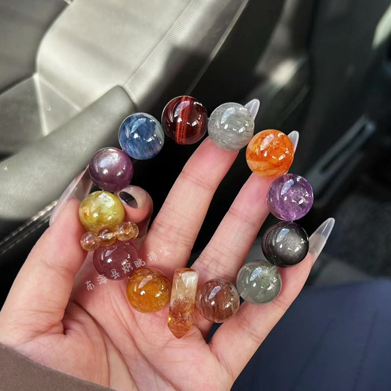 Woman wearing multi-gem crystal bracelet, everyday styling, natural light photography