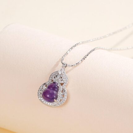 Close-up of amethyst zircon silver pendant for clarity and calm