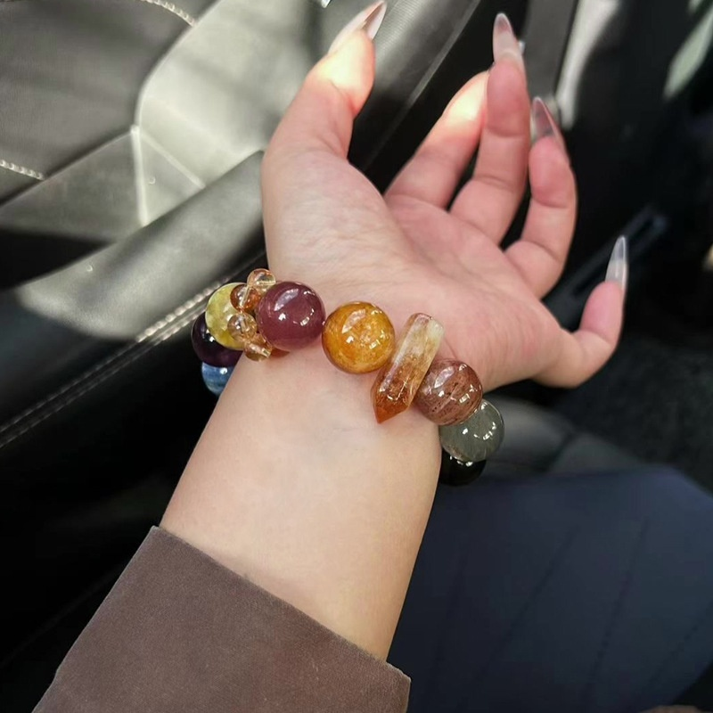 Crystal bracelet stacked on wrist, layering styling, multi-gem energy bracelet