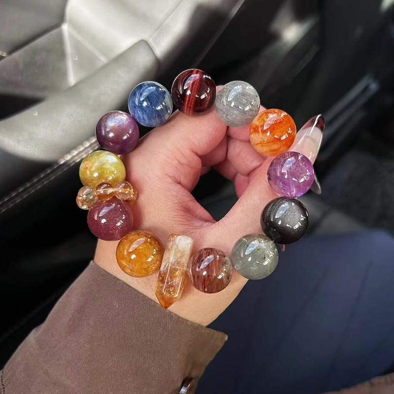 Amethyst, Black Obsidian and Yellow Crystal bracelet on white background, 18mm polished beads, minimalist crystal jewelry flat lay