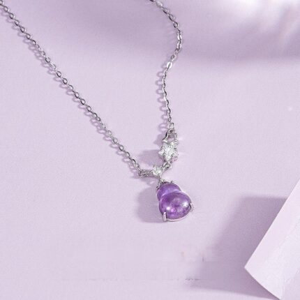 Close-up of polished amethyst gourd pendant for clarity and calm