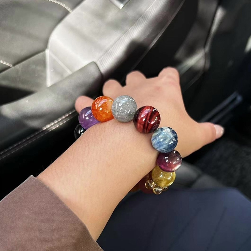 Close-up detail of Amethyst, Black Obsidian and Yellow Crystal beads, showing natural color and polished