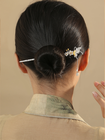 Buyao hairpin worn in traditional updo, butterfly flower hair ornament, feminine chinese traditional hair styling, delicate dangling hairpin