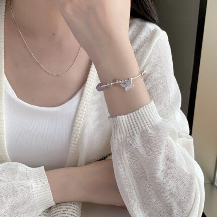Elegant purple crystal bracelet with silver butterfly for calm energy